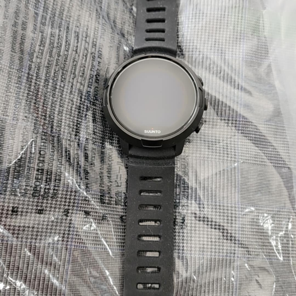 Suunto Black Smartwatch with Circular Display and Silicone Strap